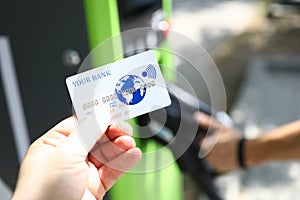 Male hand hold white plastic credit card