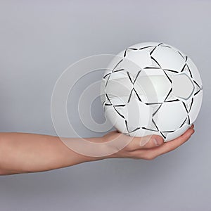 Male hand holding ball