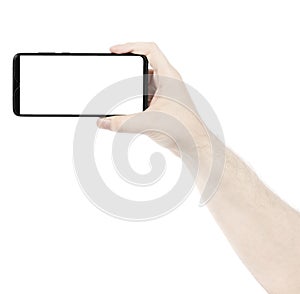 Male hand holding the black new smartphone with blank screen isolated white background. Man hands using phone clipping path. blank