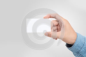 Male hand holding blank business card isolated