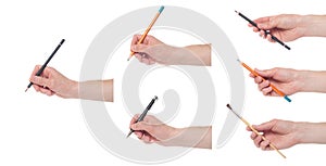 Male hand holding a brush on a white background