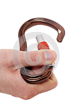 Male hand holding climbing carabiner