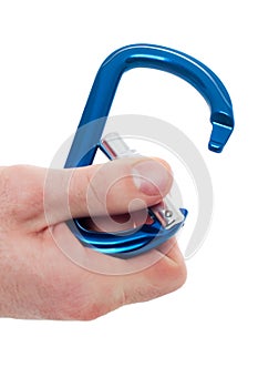 Male hand holding climbing carabiner