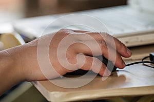Male hand holding computer mouse