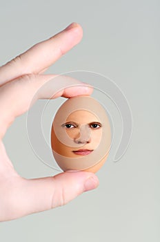 Male hand holding egg