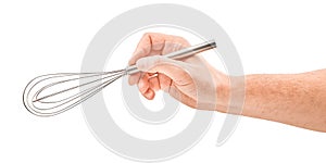 Male hand holding a egg beater mixer whisk, isolated over the white background