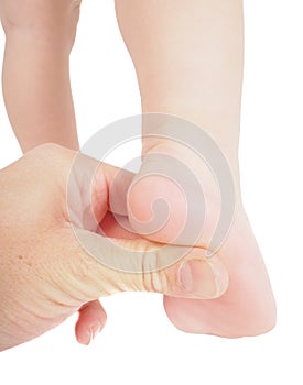 Male hand holding firmly pressing with thumb under foot