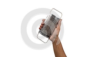 Male hand holding kitchen grater  white background