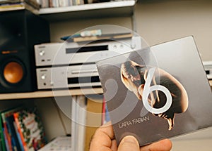Male Hand Holding Lara Fabian's '6' SACD Album Cover