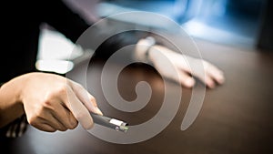 Male hand holding laser pointer in meeting room