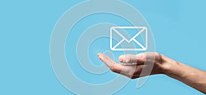 Male hand holding letter icon,email icons .Contact us by newsletter email and protect your personal information from spam mail.