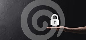 Male hand holding a lock padlock icon.Cyber security network. Internet technology networking.Protecting data personal information