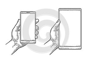 Male hand holding a modern mobile phone. Vintage drawn vector engraving