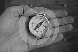 Male hand holding old compass. Includes clipping path