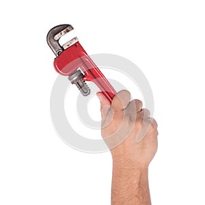 Male hand holding pipe wrench