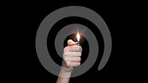 Male hand holding a red lighter, isolated on white background. Hand holding burning gas lighter.