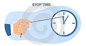 Male hand is holding rope attached to clock to stop time