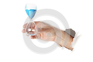 Male hand holding an sand hour glass on white background