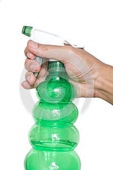 Male hand holding spray bottle