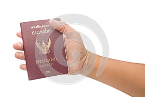 Male hand holding Thailand passport isolated on white background