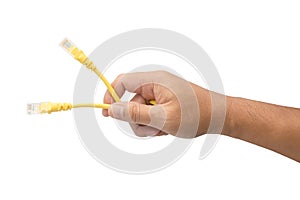 Male hand holding yellow lan cable isolated on white background