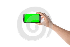 Male hand holds black smartphone. Isolated screen with chroma key and all isolated on white background