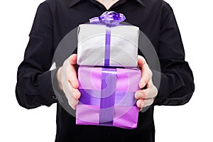 Male hand holds silver gift over a white background