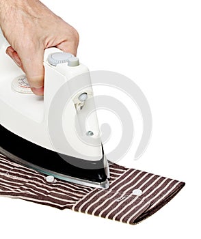 Male hand ironing shirt