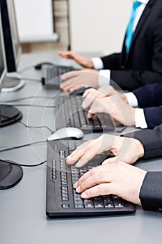 Male hand on keyboard typing and scroll mouse