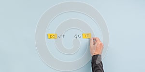 Male hand making a dont quit sign