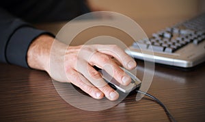 Male hand on mouse