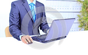 Male hand on mouse while working