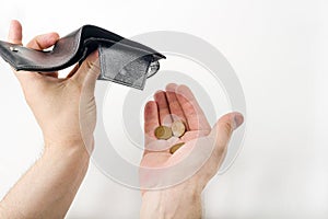 Male hand opening a wallet and count coins money on white background. World economic crisis. Financial problem jobless,