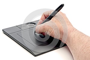 A male hand operating a pen computer input device