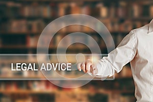 Male hand pressing the word legal advice on a virtual search display bar. Online legal advice