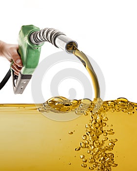 Male hand pumping gasoline in a tank