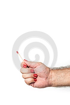 Male hand with red fingernails hold unlit matchstick