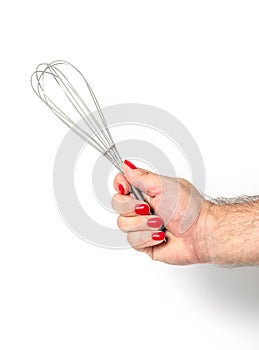 Male hand with red fingernails hold Whisk