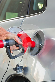 Male hand refuel the car