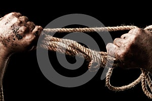 Male hand with rope. Conception aggression