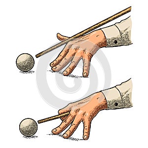 Male hand in a shirt is aimed cue the ball.