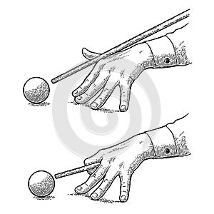 Male hand in a shirt is aimed cue the ball.