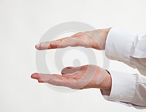 Male hand showing a fatness photo