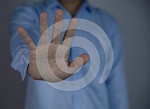 male hand showing stop gesture Concept of stop violence.