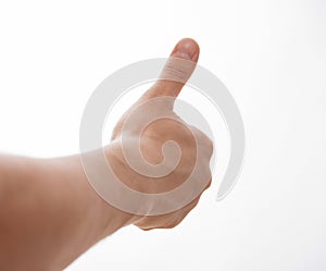 Male hand showing a thumb up sign