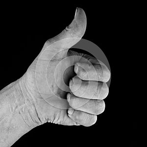 Male hand showing thumbs up for success