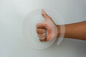 male hand showing tumbs up gesture. thumbs up sign