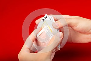 Male hand shuffling playing cards on the table. Board game