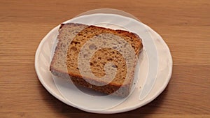 Male hand with slice of rye bread on plate. Full HD
