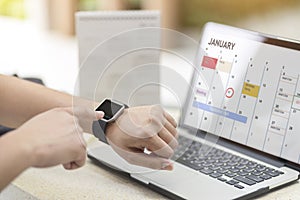 Male hand with smart watch on wrist. Planning agenda and schedule using calendar event planner. Calender planner, relax time